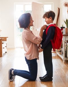 little boy and mum starting school